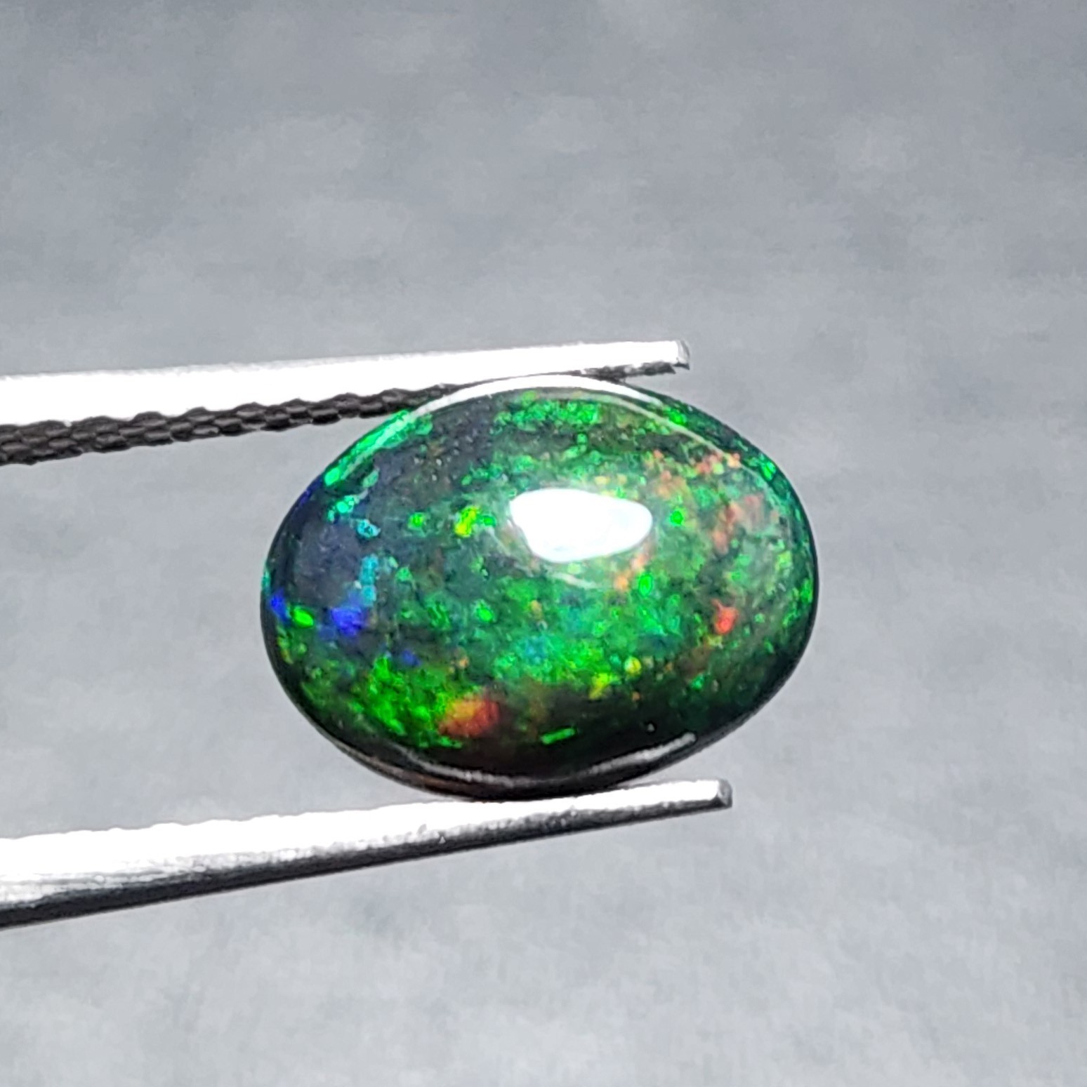 Natural Welo Black Opal Ethiopia Oval Cabochon Vivid Green Fire Gemstone 1.20Ct