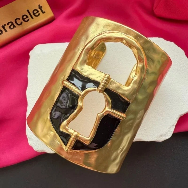 Schiaparelli Black and Gold Keyhole Cuff Bracelet. With Box and Pouch.