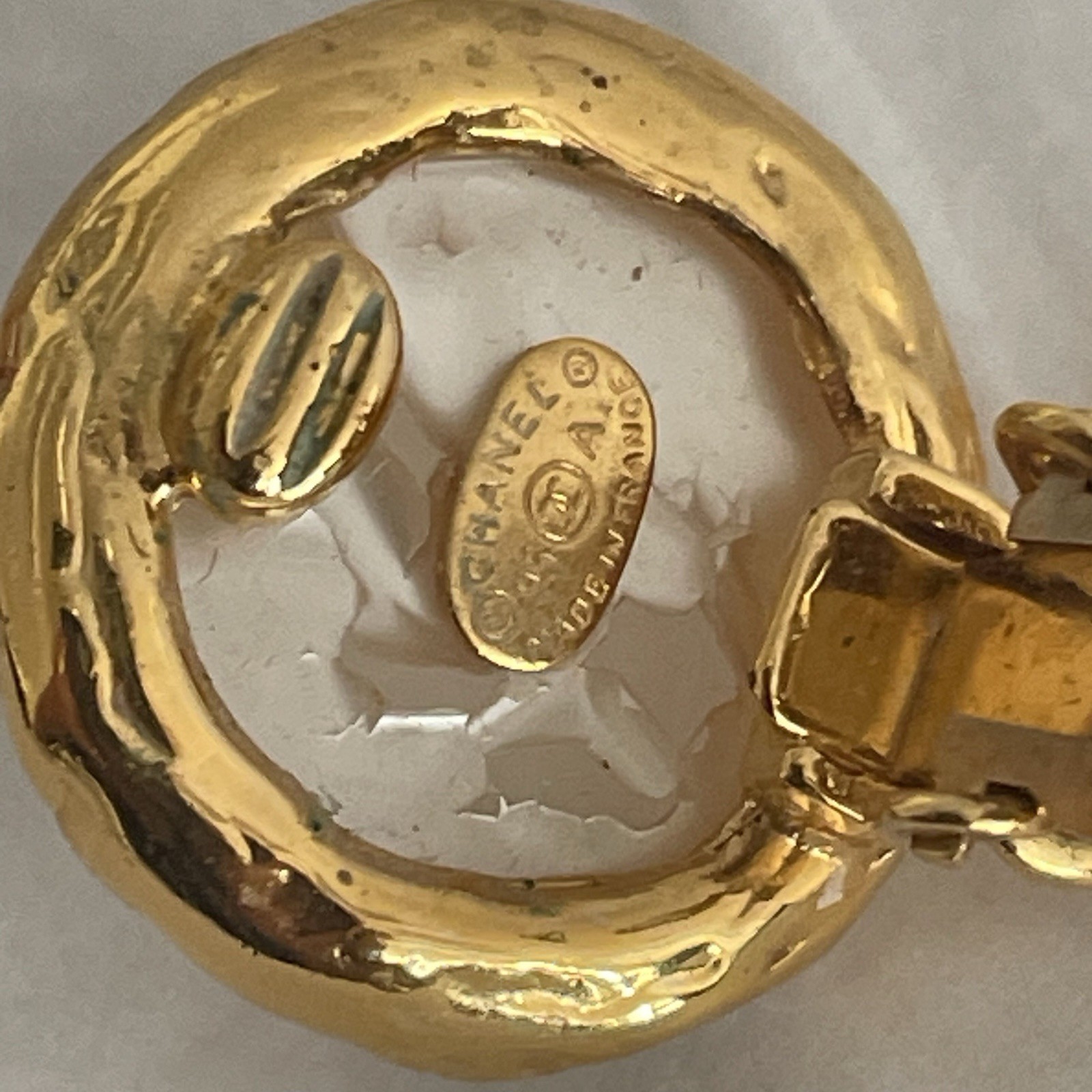 Auth. vtg CHANEL 1995 gold 3D CC logo dangle with round moonlight stone stamped