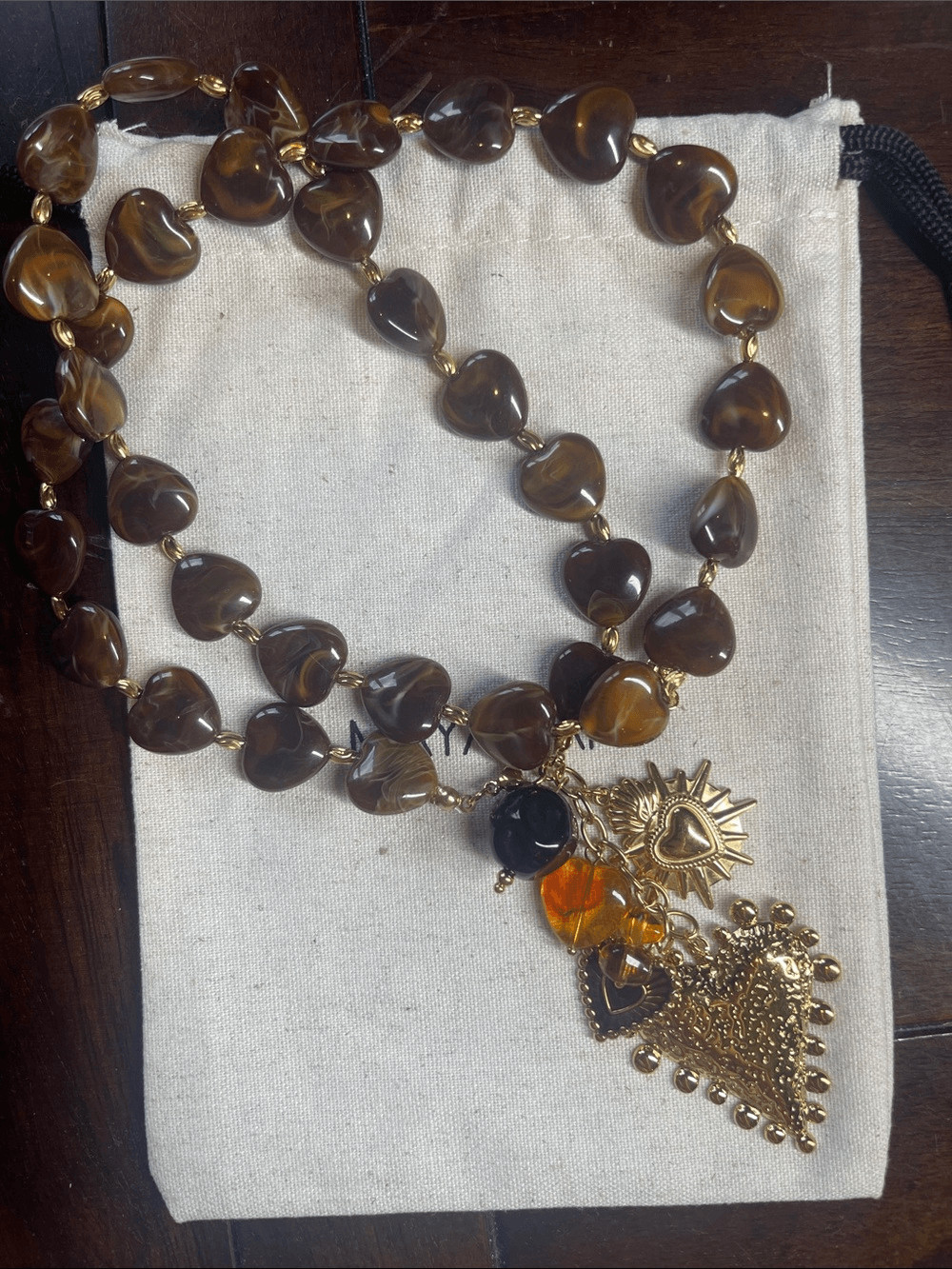 Gold-Accent Brown Heart Bead Necklace with Decorative Charm Drop