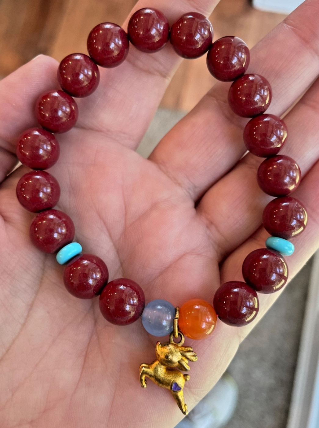 Cinnibar bracelet with deer charm (10.6mm)