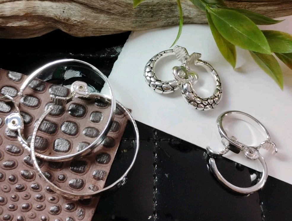 The JEWELRY GROUP TJG Set of THREE (3) Silver Toned Hoop Clip On Earrings!