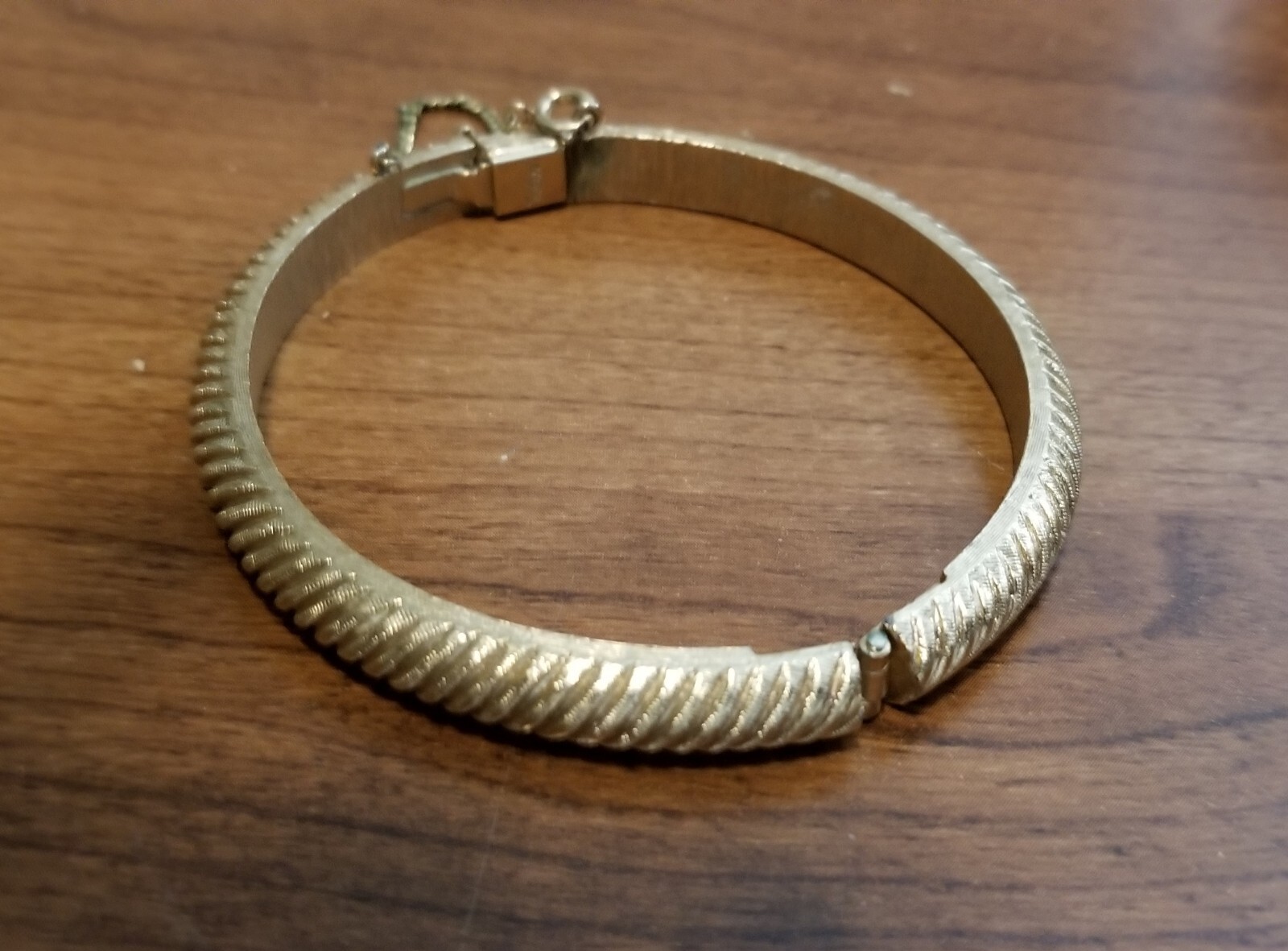 Vintage Crown Trifari Gold Hinged Bangle Bracelet With Safety Chain.
