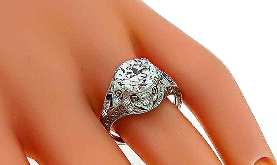 Impressive Milgrain, Engravings & Open Work Design With White CZ & Sapphire Ring
