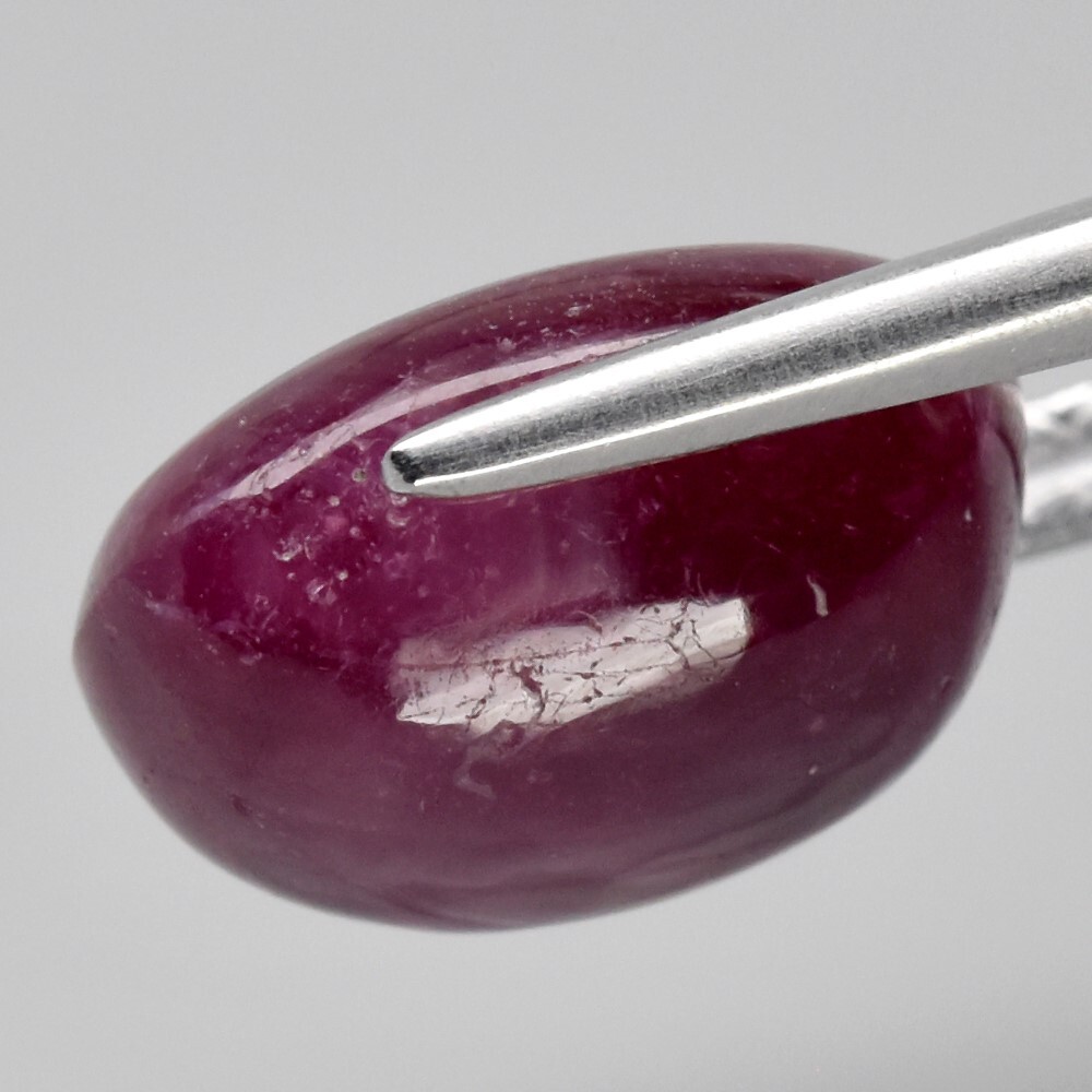 9.05ct 12×9.8mm Oval Cab Purplish Red 6 Ray Star Ruby (Heated Glass Filling)