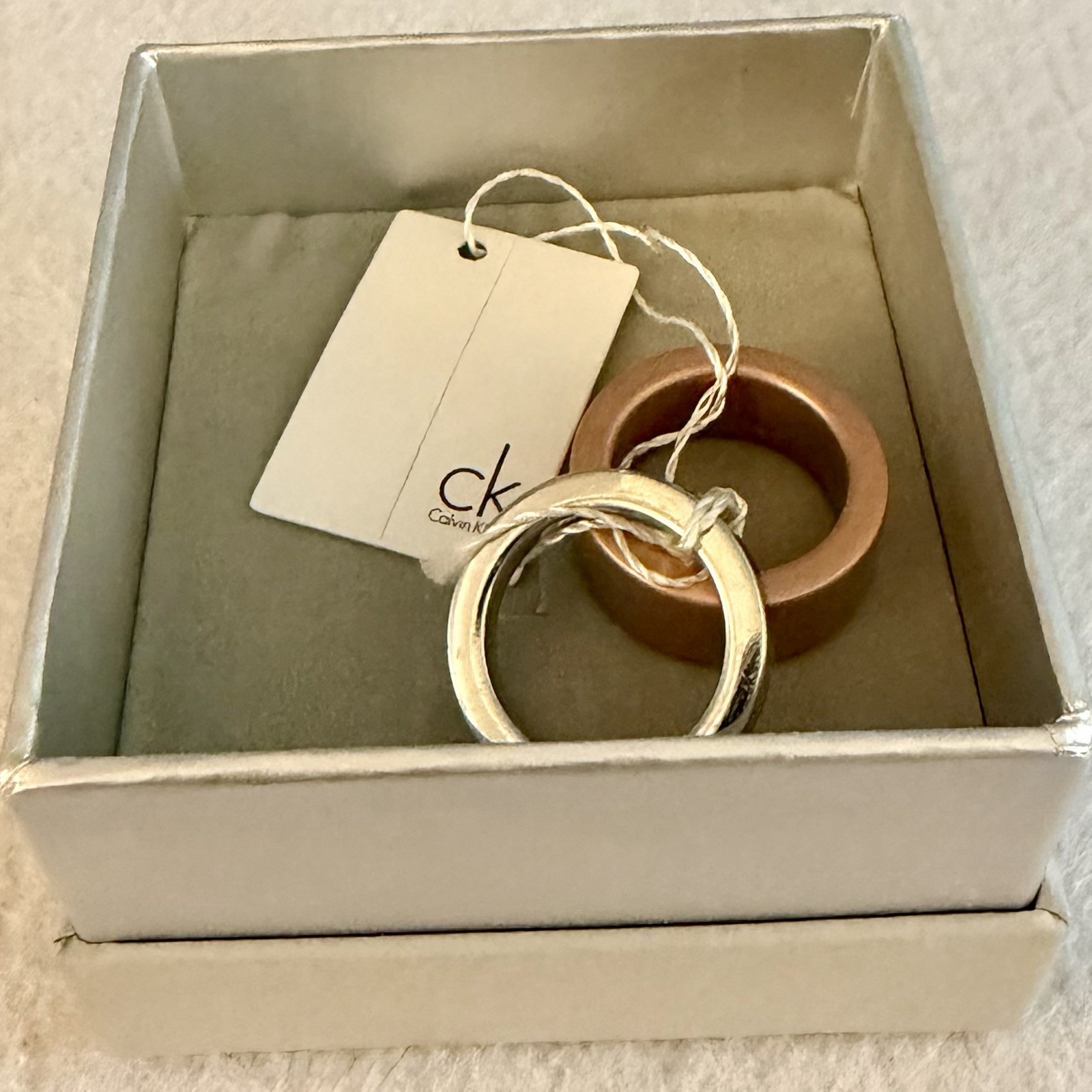 NIB Calvin Klein Two-Tone Interlocking Band Ring – Silver & Rose Gold Steel Sz 6