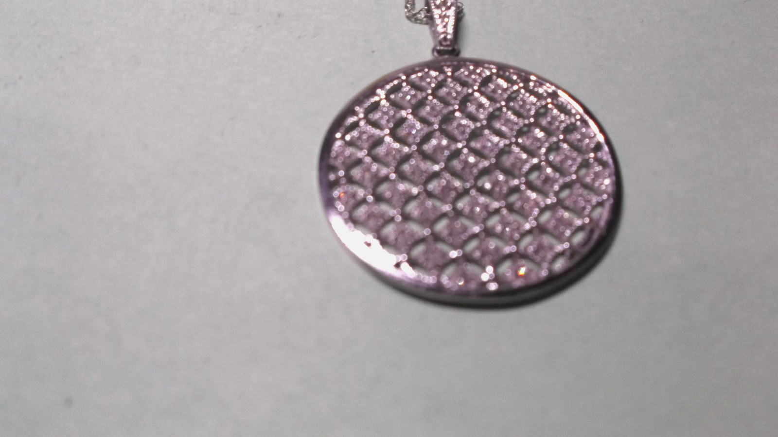 14K White Gold Round Diamond Disc Pendant Necklace 4.40 Grams in Lighted Display
