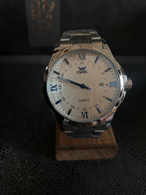 Classic Luxury Silver Quartz Watch with Blue Accents