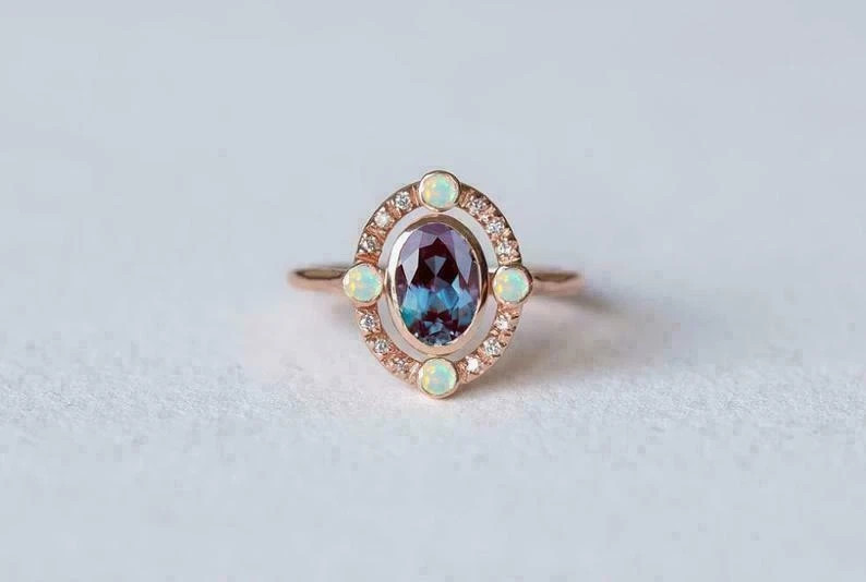 2.50Ct Oval Cut Lab-Created Opal Bezel Set Engagement Ring 14K Rose Gold Over