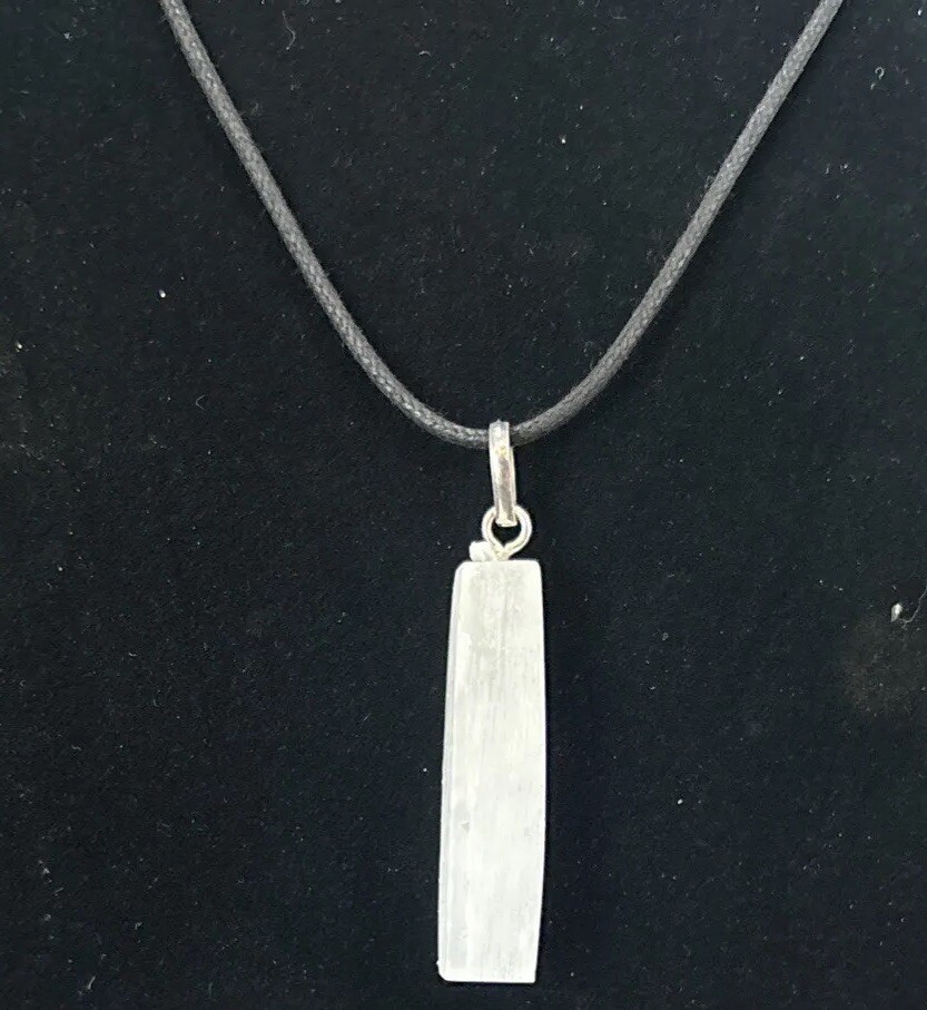 Selenite top drilled pendant with silver colored bail and adjustable cord