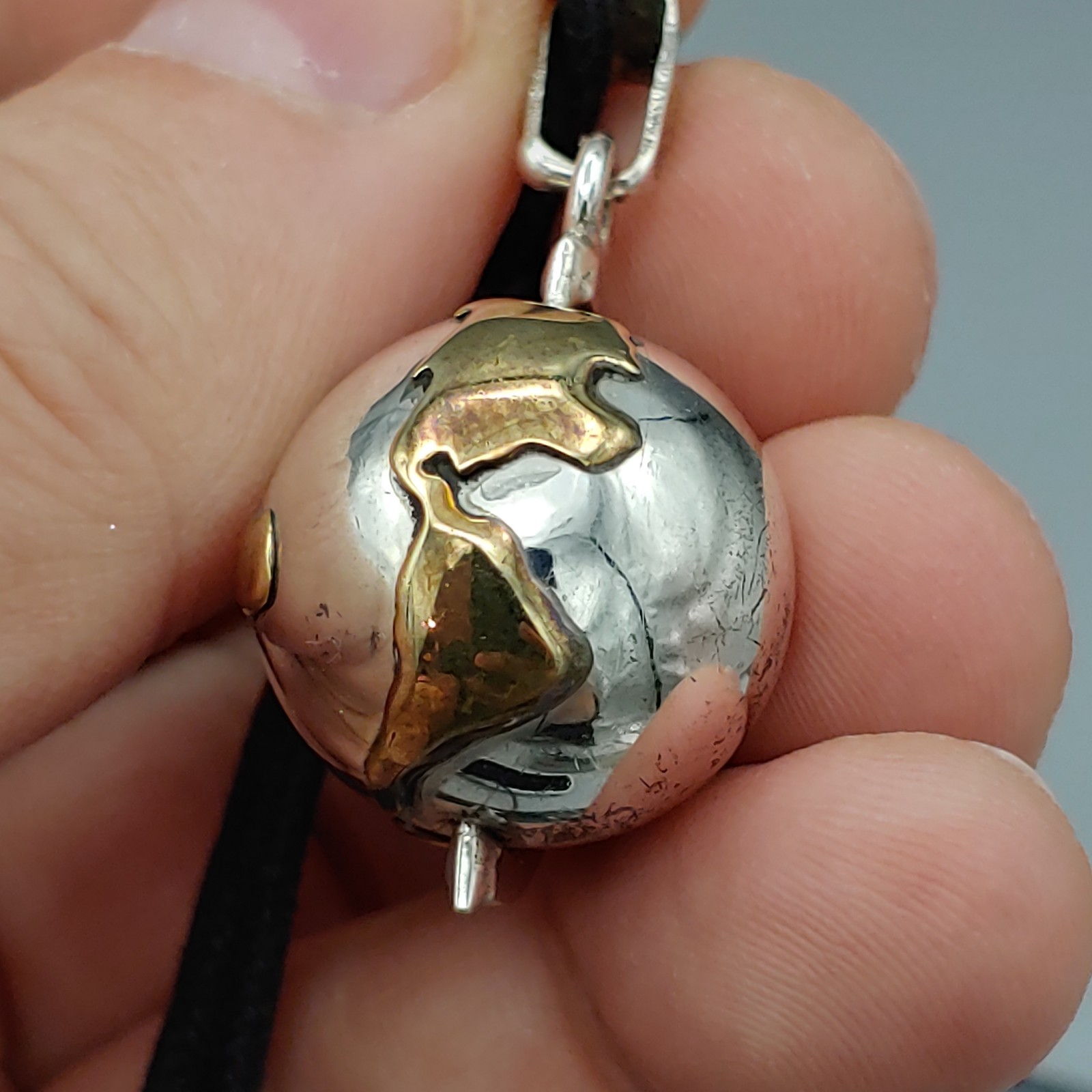 VTG Taxco TR-77 Mexico Sterling Silver .925 and Brass Earth Harmony Spin Pendant