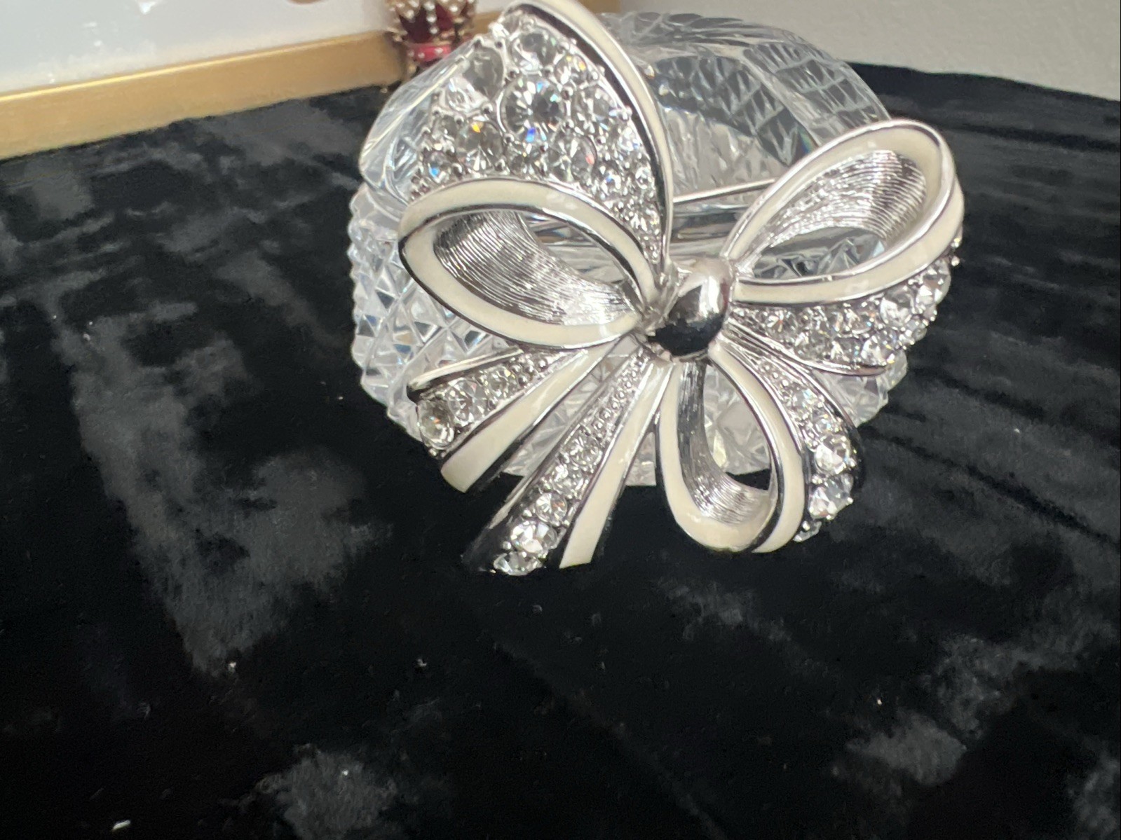 item is a Nolan Miller Shining Spirit rhinestone bow brooch from the Glamour CO.