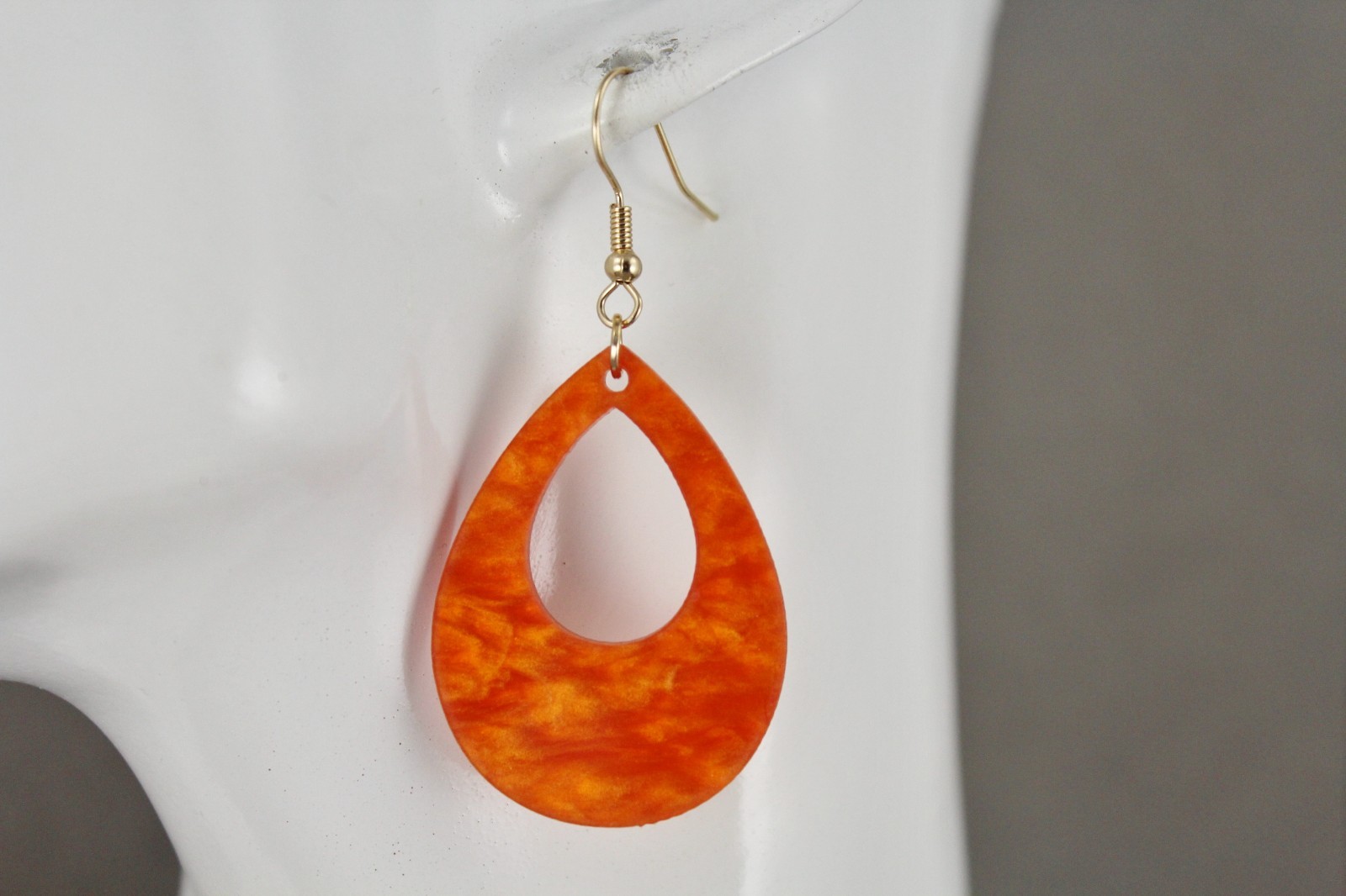 Orange teardrop earrings lightweight dangle cut out oval outline 2.25″ long