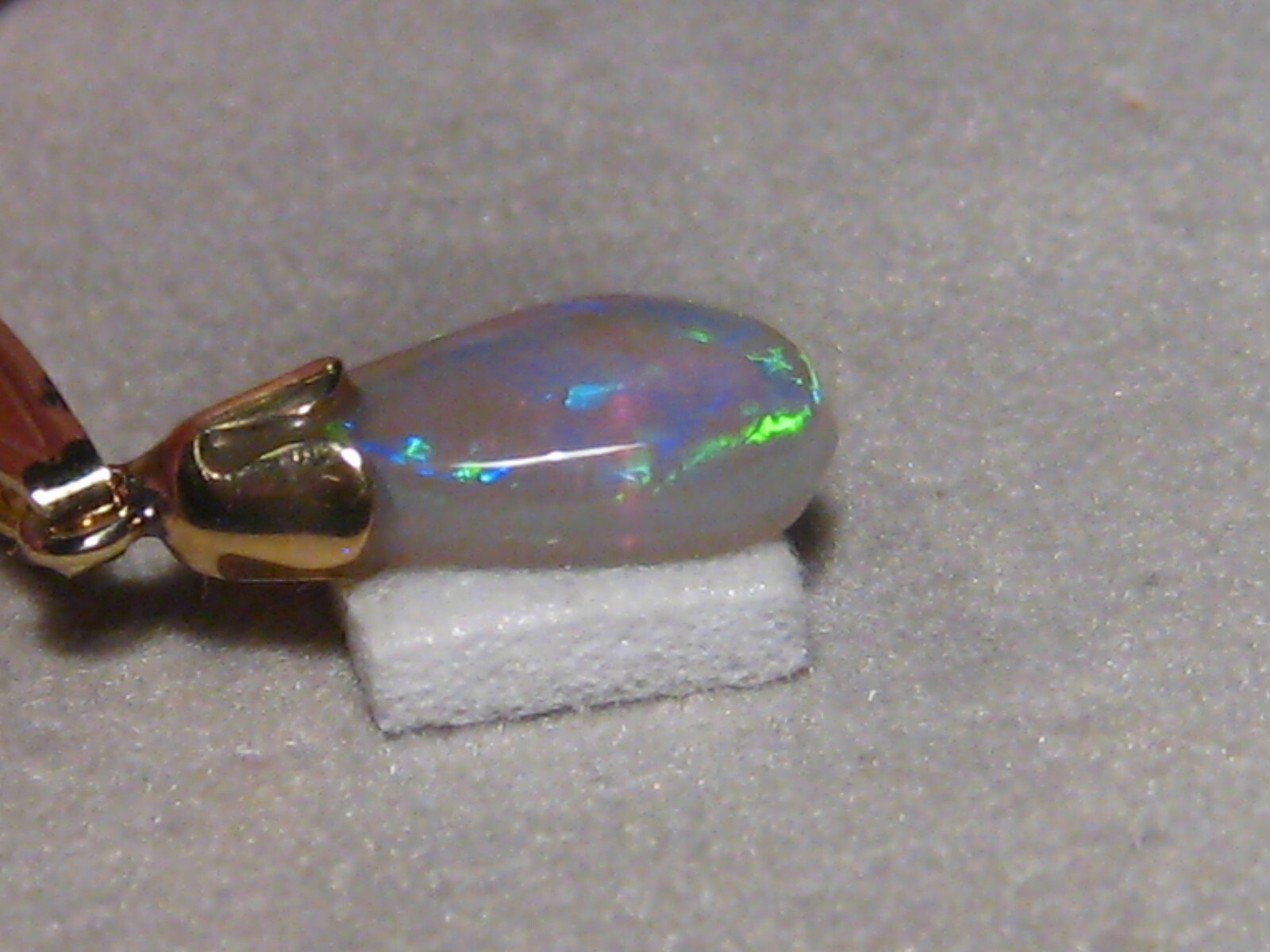 .90 ct. small Bright Opal Pendant , Solid 14 k yellow gold
