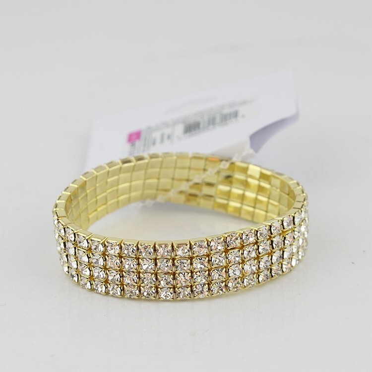 Gold tone 4 row crystal stretch bracelet, adjustable to fit all