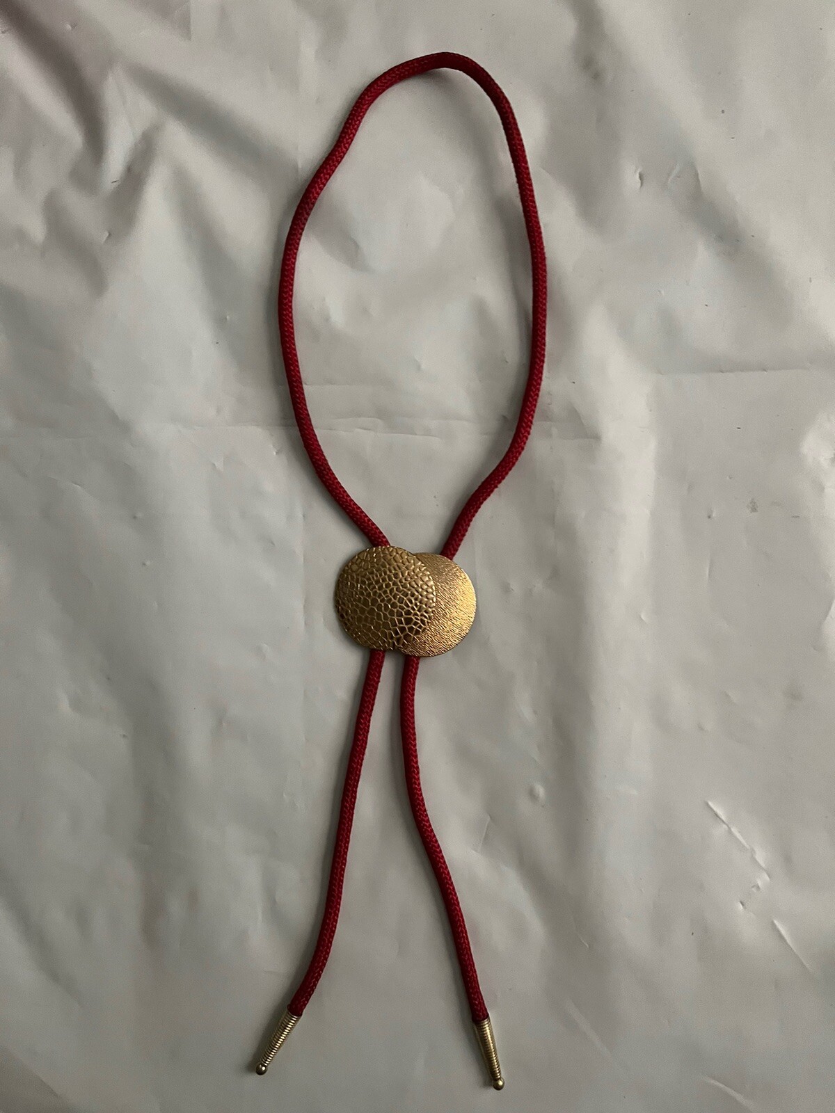 Bolo Tie, Cloth red cord with a double golden textured orb slide + terminals