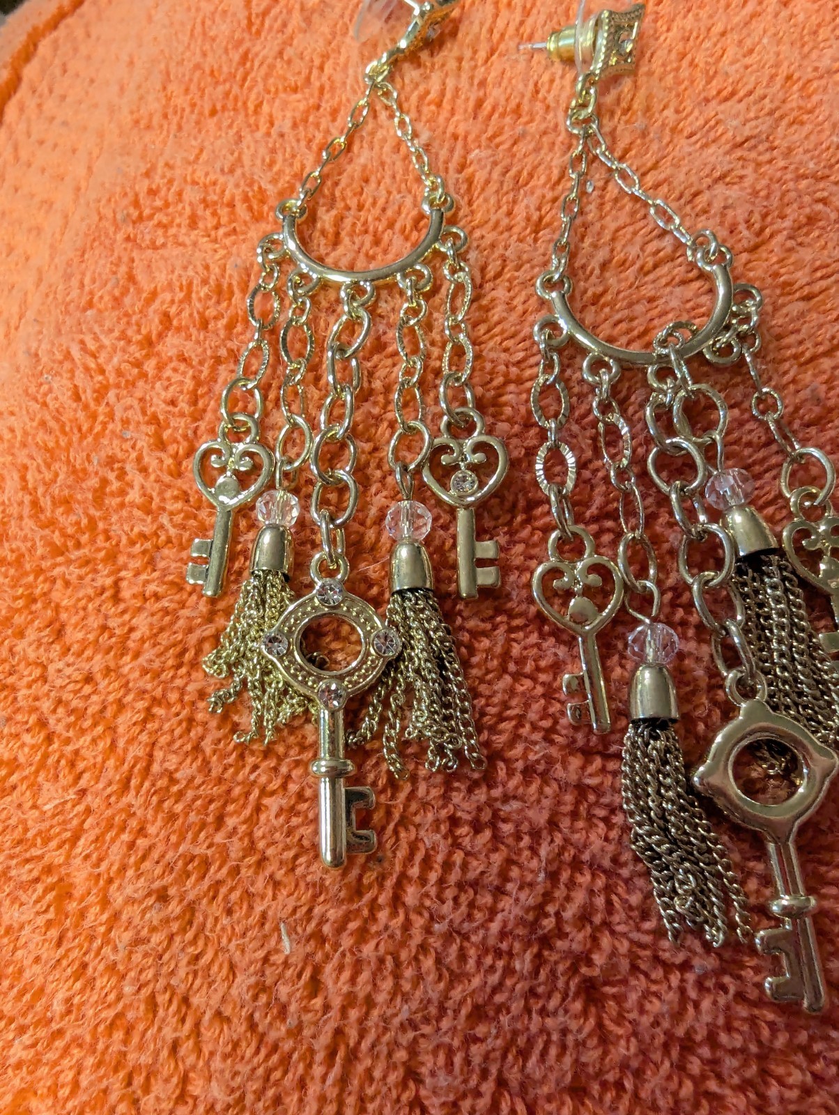 Earrings With Dangling Chains And Various Pendants