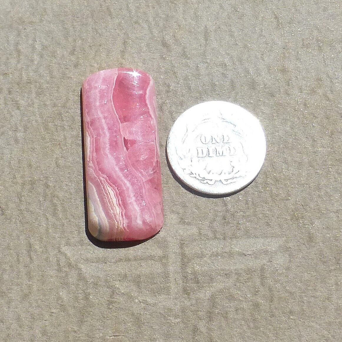 Pink w/calcite banding natural Rhodochrosite cabochon Argentina (27.60 carats)
