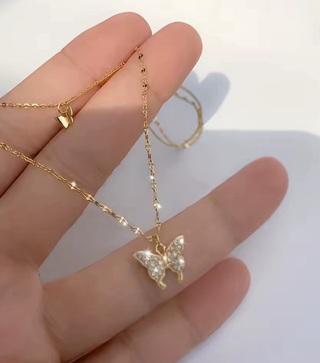 Gold Tone Layered Butterfly Charm Necklace with Clear Crystal Pendant, 16.14″