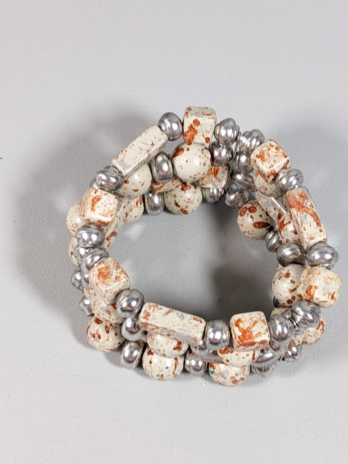 Silver Tone Ivory Color Brown Splatter Four Row Wide Stretch Bracelet 6 inches