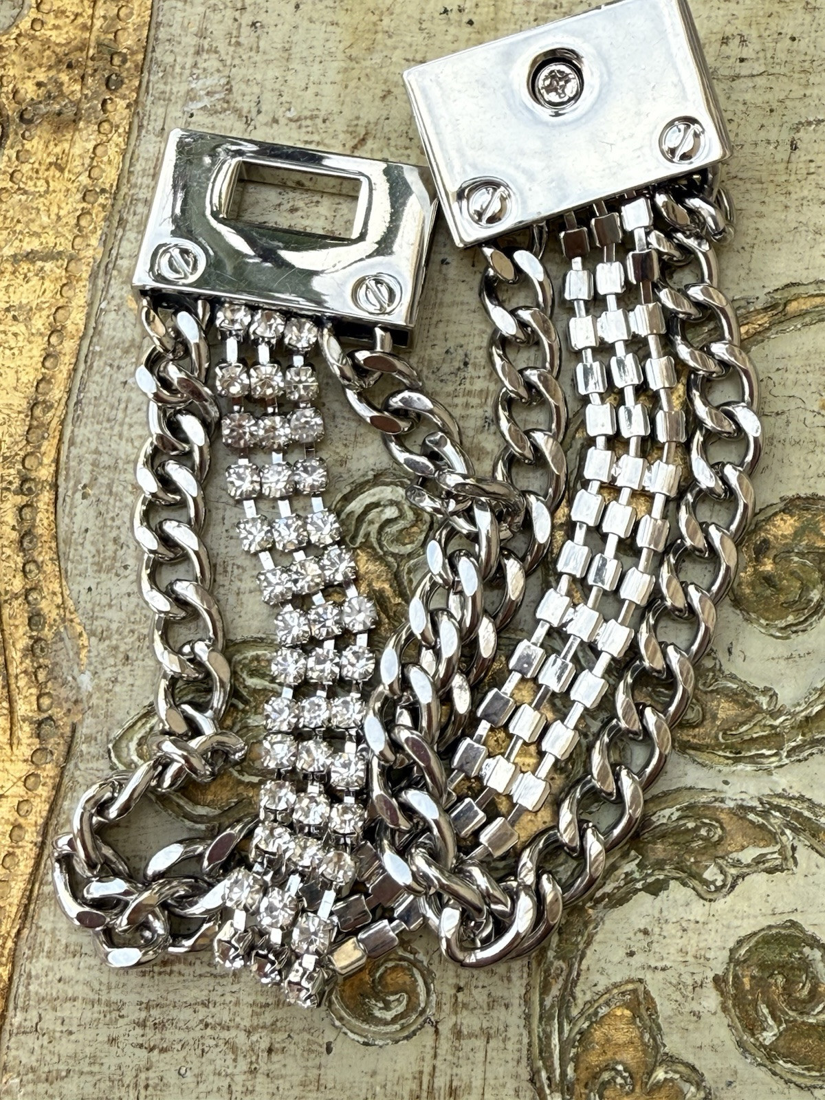 Silver Triple Link Turn Lock Chain Bracelet With Center Rhinestone Details