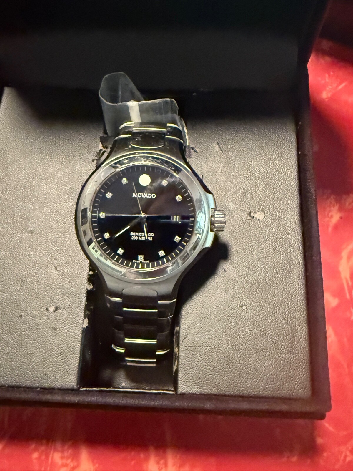MOVADO 800 SERIES WATCH WITH BLCK BEZEL AND DIAMOND MAKERS – MENS WATCH