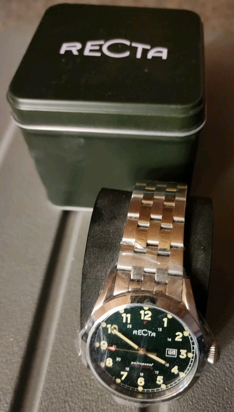 Recta mens watch has stainless bezel and band. Very classy
