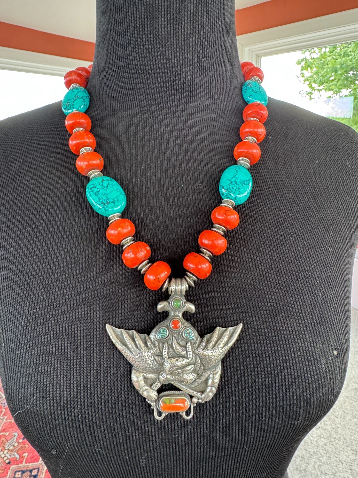 Silver Garuda pendant strung with natural coral and turquoise