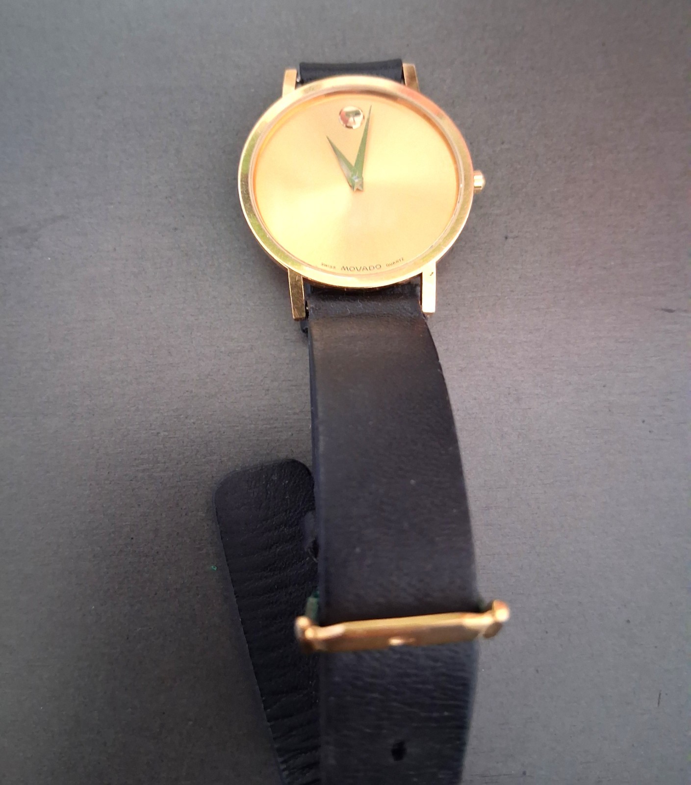 Movado Museum Wrist Watch for Men, gold face, black leather band, NEW Battery