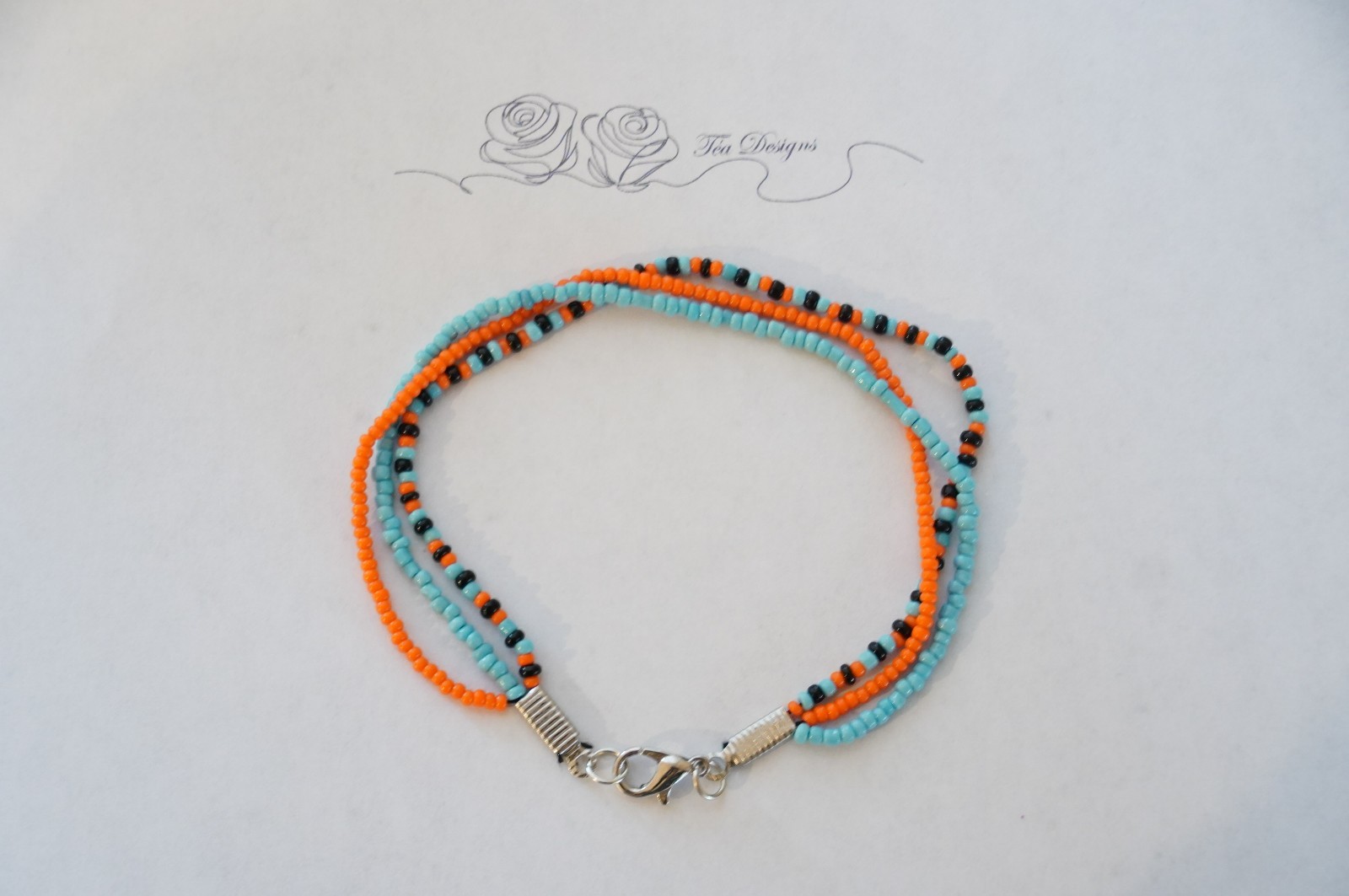 Multi-color Black, Blue, & Orange Glass Seed Bead 8″ Bracelet