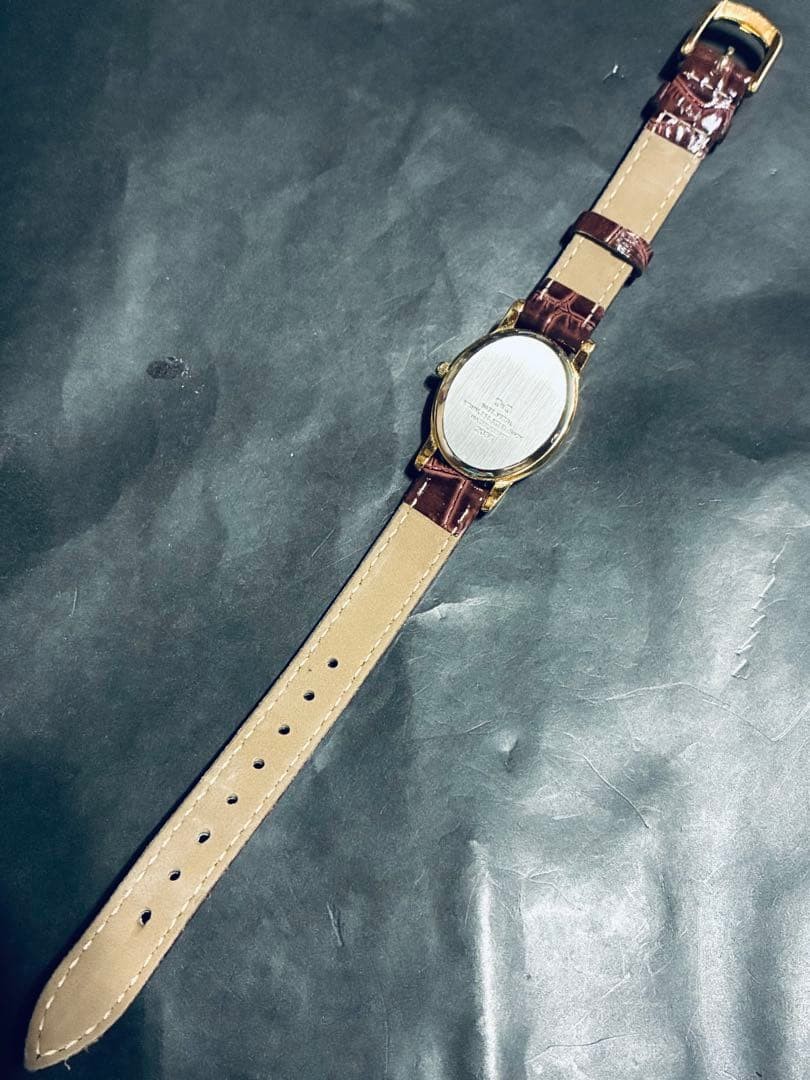 New battery. CITIZEN Q&Q gold Arabic numeral watch with brown strap.