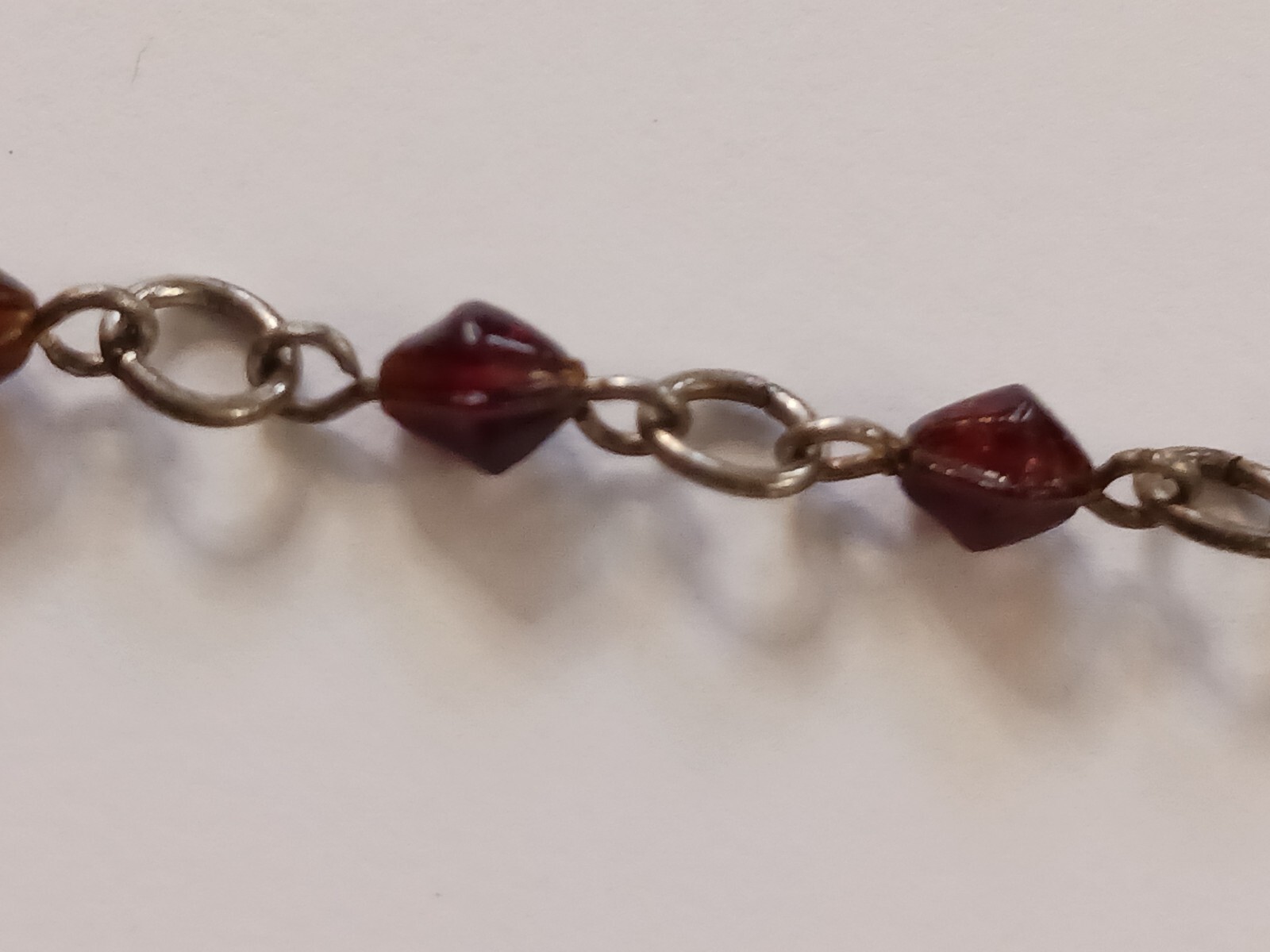 Beautiful silver tone necklace with flowers and red stones. hook clasp. Vintage