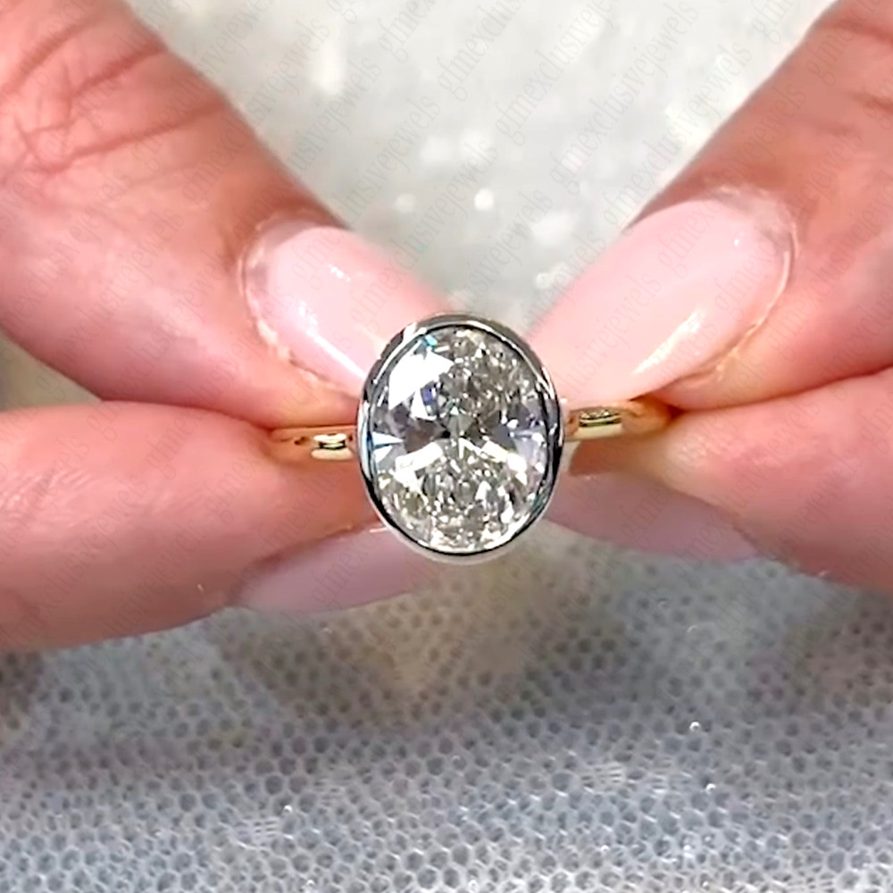 3.85Ctw Oval Moissanite Bezel Hidden Halo Engagement Ring In 14K Two-Tone Gold