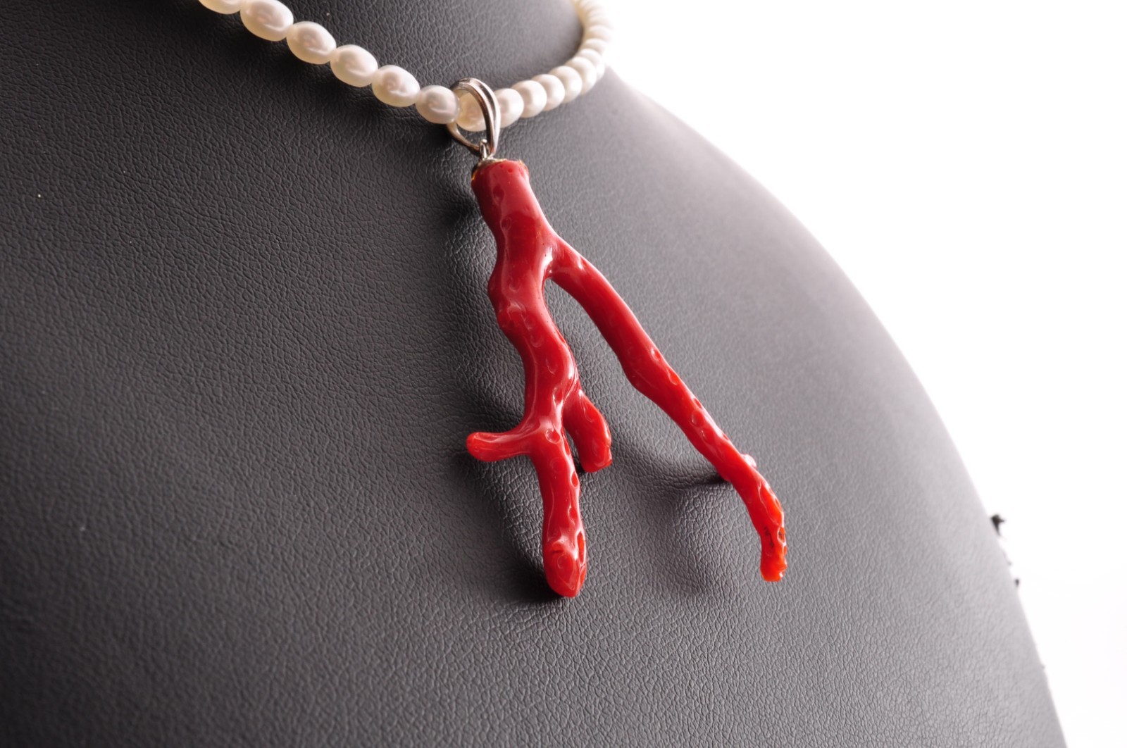 Sterling silver clasp, red coral and pearl pendant (total 54.0ct) Certification.