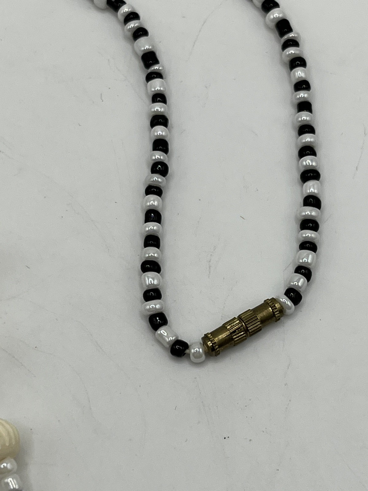 Carved Pendant Black and White Beaded Necklace 20”