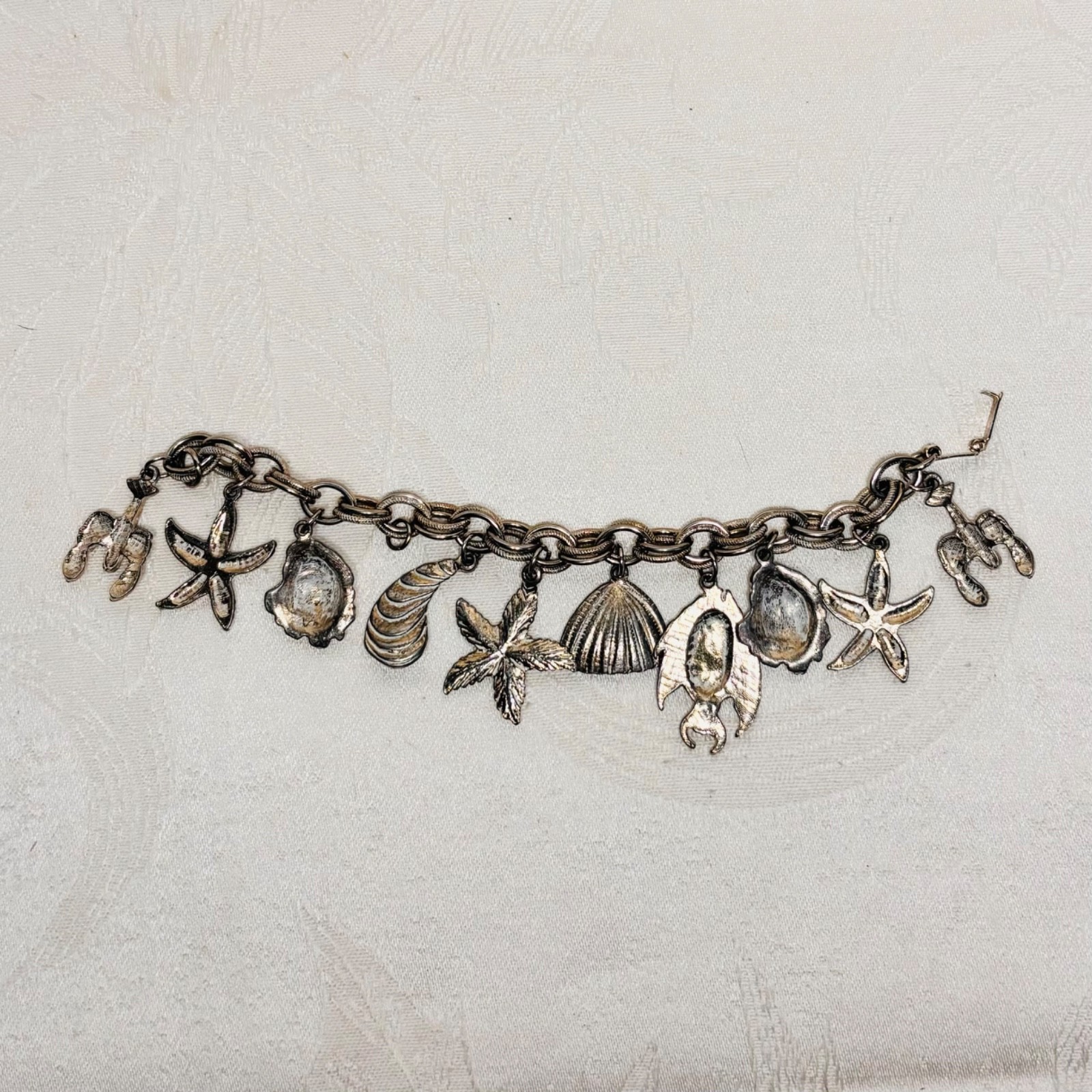 BRACELET ocean life charms starfish shells fish lobster fold over clasp vintage