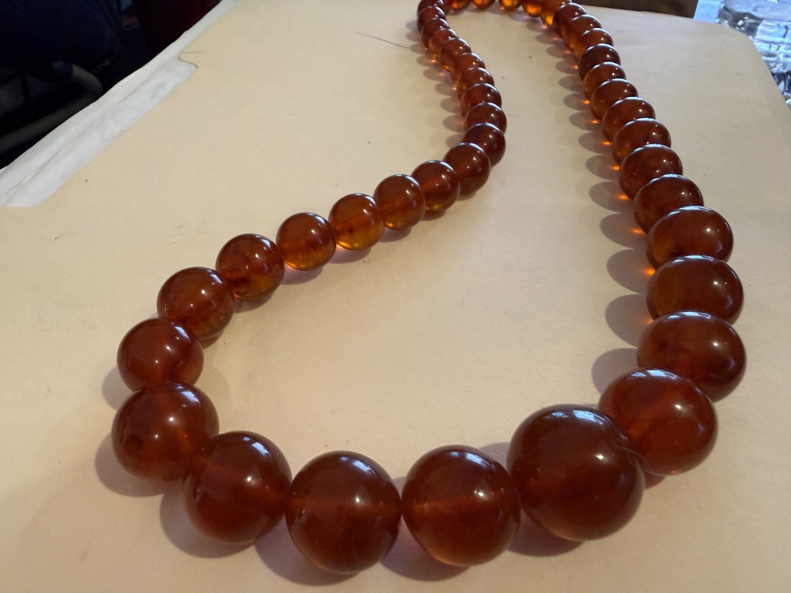 24 Inch long Vintage Graduating large bead Amber Necklace w matching clasp