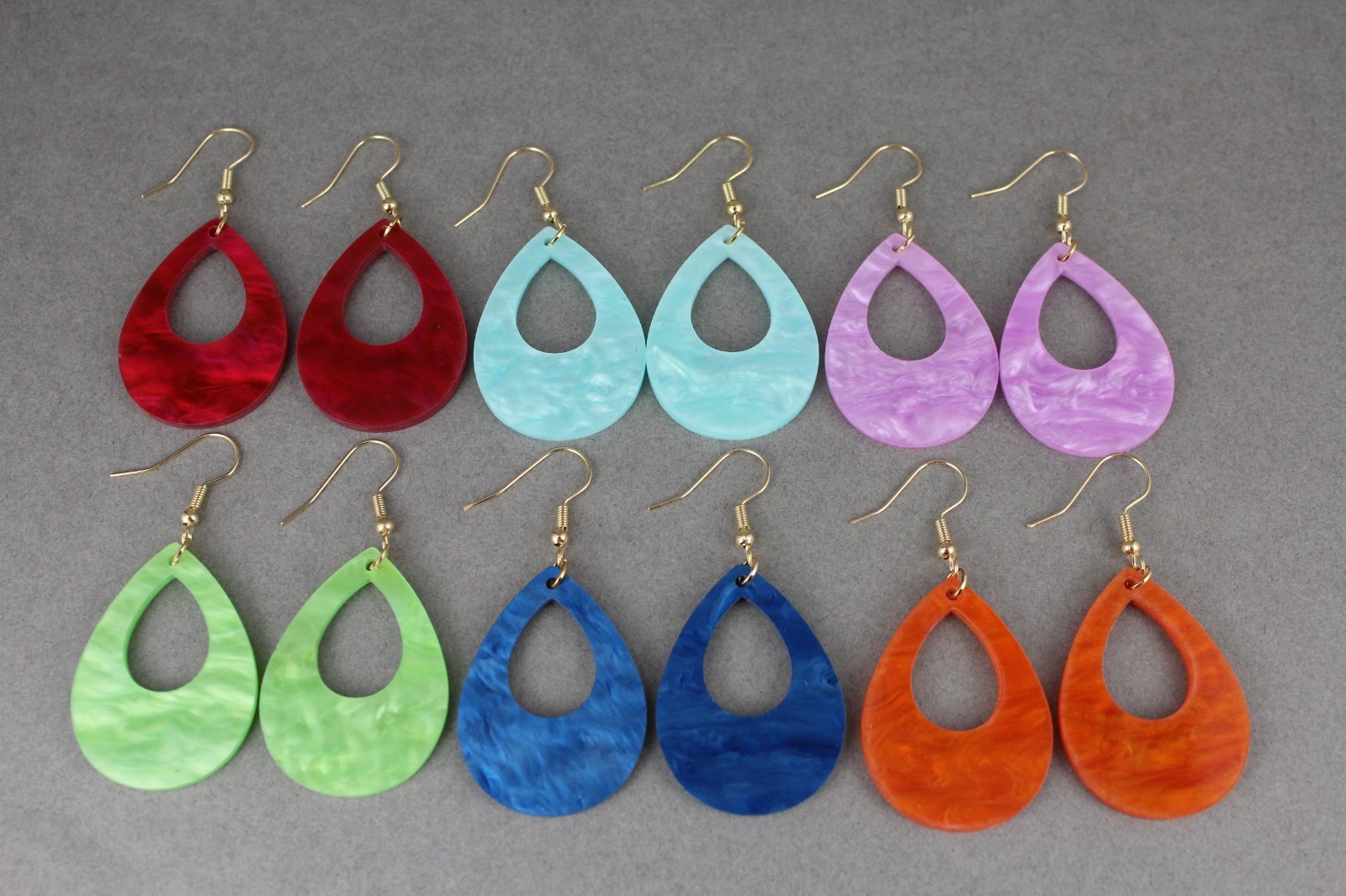 Orange teardrop earrings lightweight dangle cut out oval outline 2.25″ long