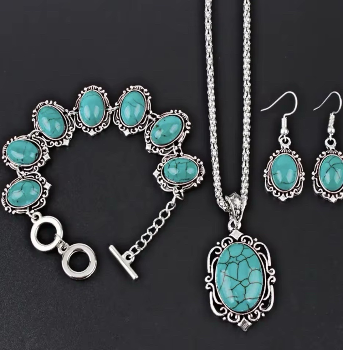 The jewelry set includes a matching necklace, earrings, and bracelet,