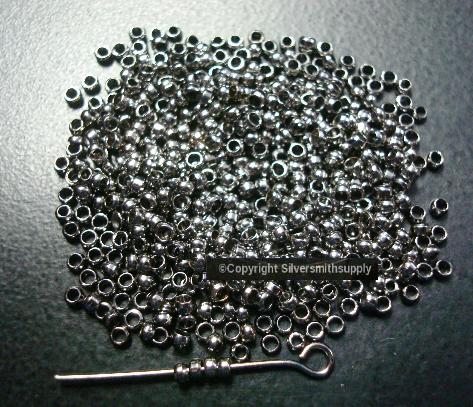 CRIMP BEADS Gunmetal Black plated 2x1mm round crimp beads FPS128B
