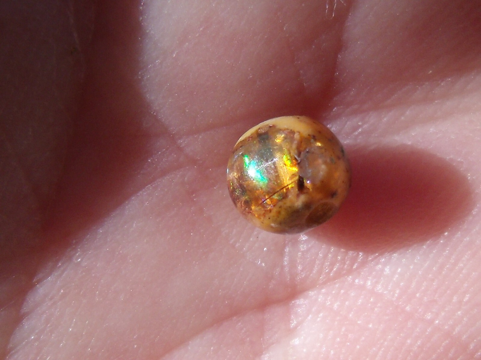 0.82 Ct. Round Cut Mexican Cantera fire opal bead.