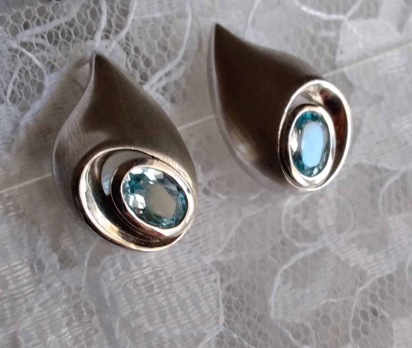 Unique Shape Blue Topaz Post Earrings Set In Satin Finish 925 Sterling Silver
