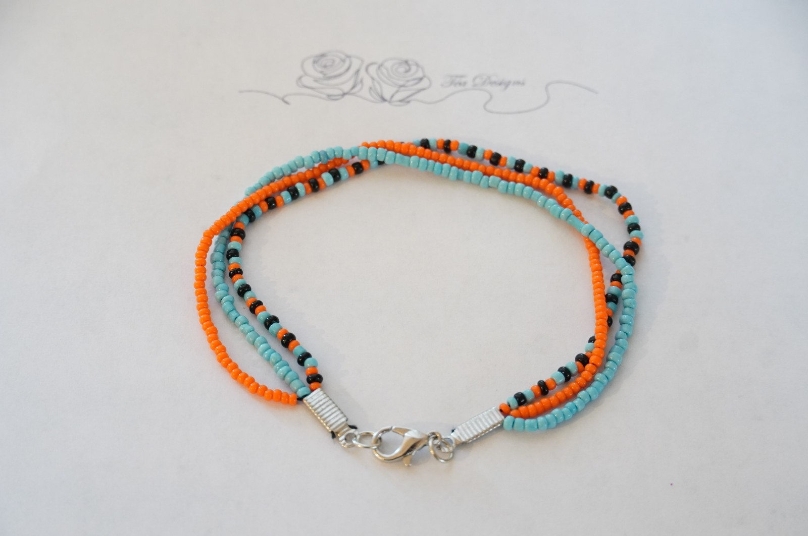 Multi-color Black, Blue, & Orange Glass Seed Bead 8″ Bracelet