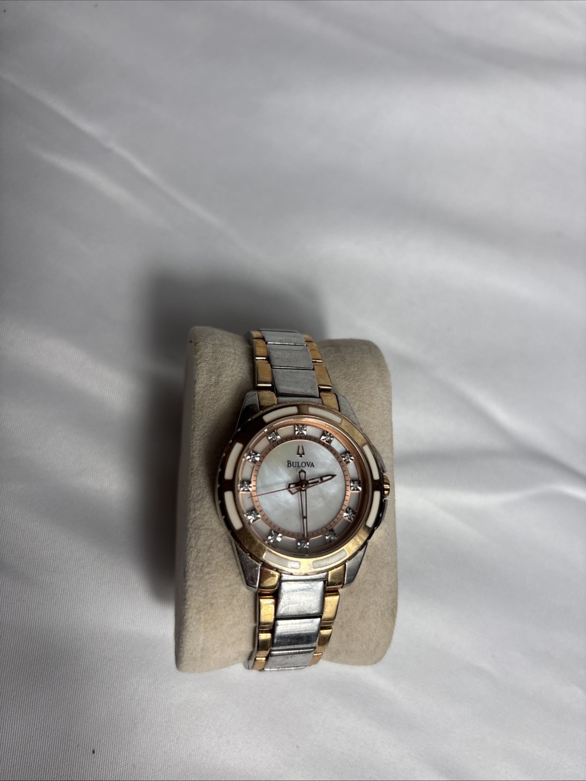 Bulova twotone women’s diamond dial watch featuring a white mother-of-pearl dial