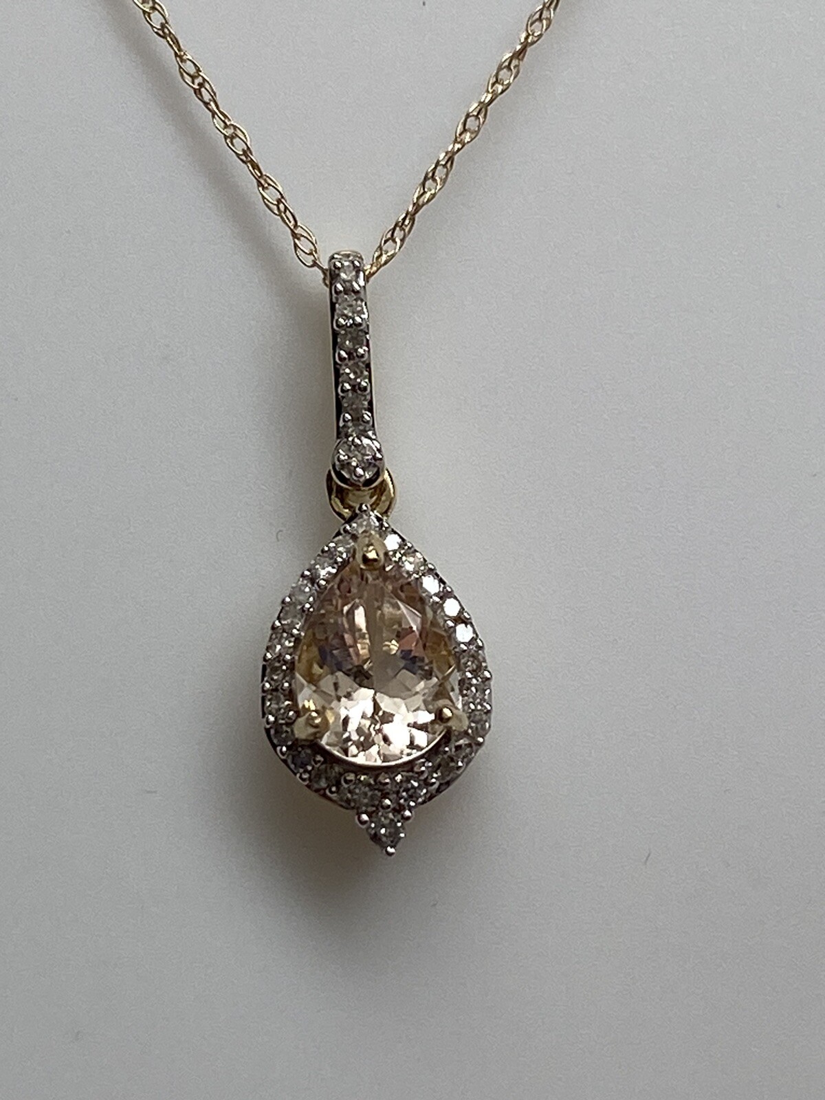 10K Yellow Gold Pear Shape Morganite and 0.11ct twt. Diamond Pendant with Chain