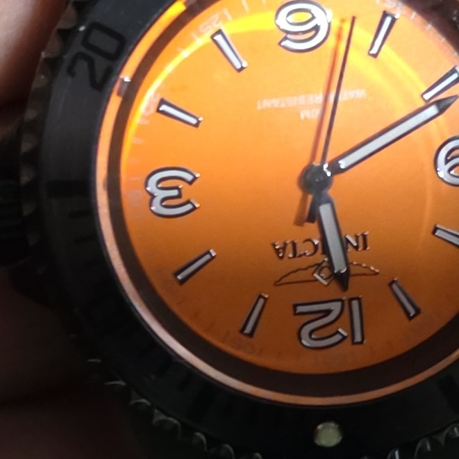 Invicta Men’s Quartz Analog Wristwatch 100m 44-47.9mm Orange Dial Black