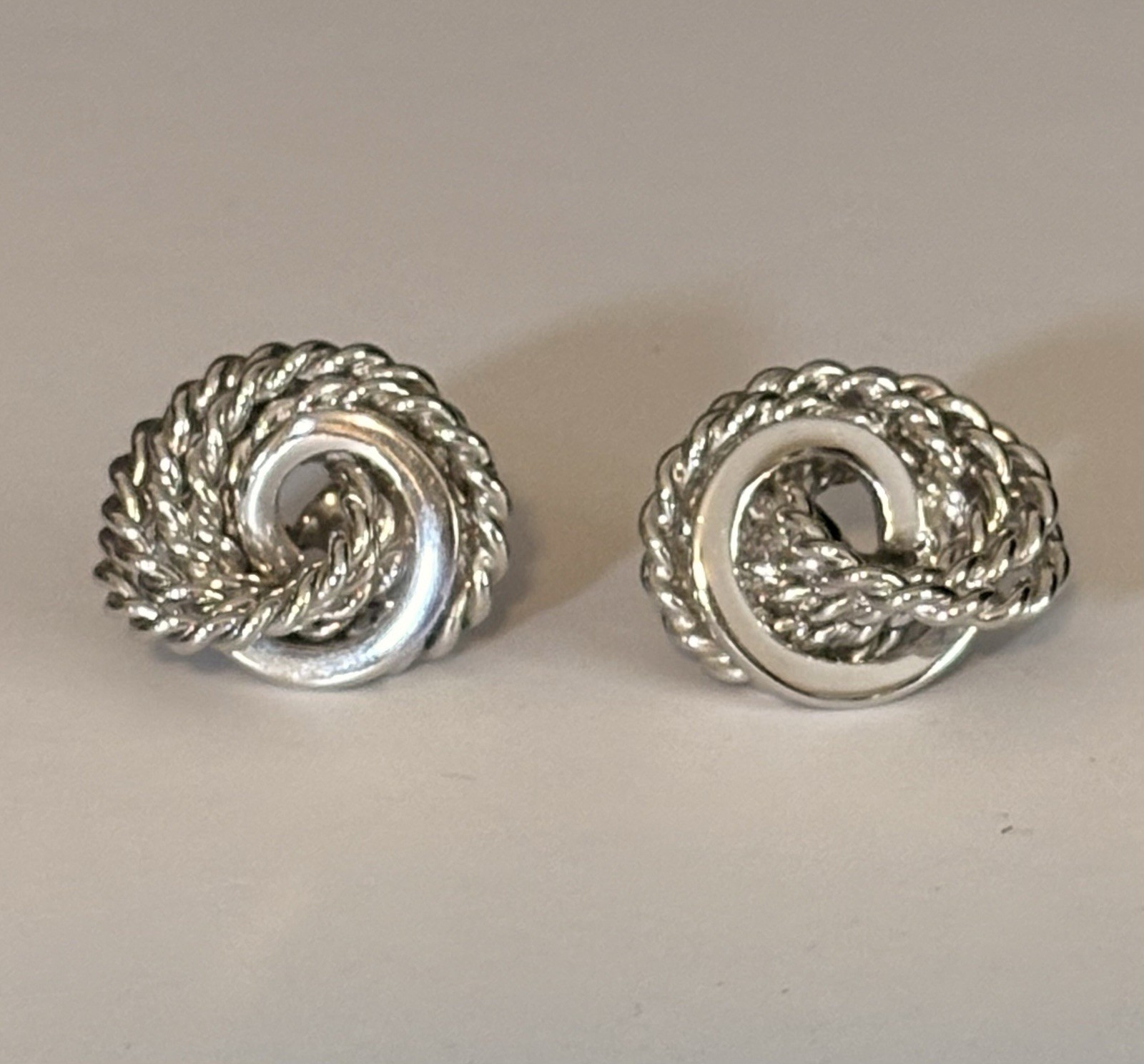 Monet Silver Tone Love Knot Textured Clip On Earrings-Vintage