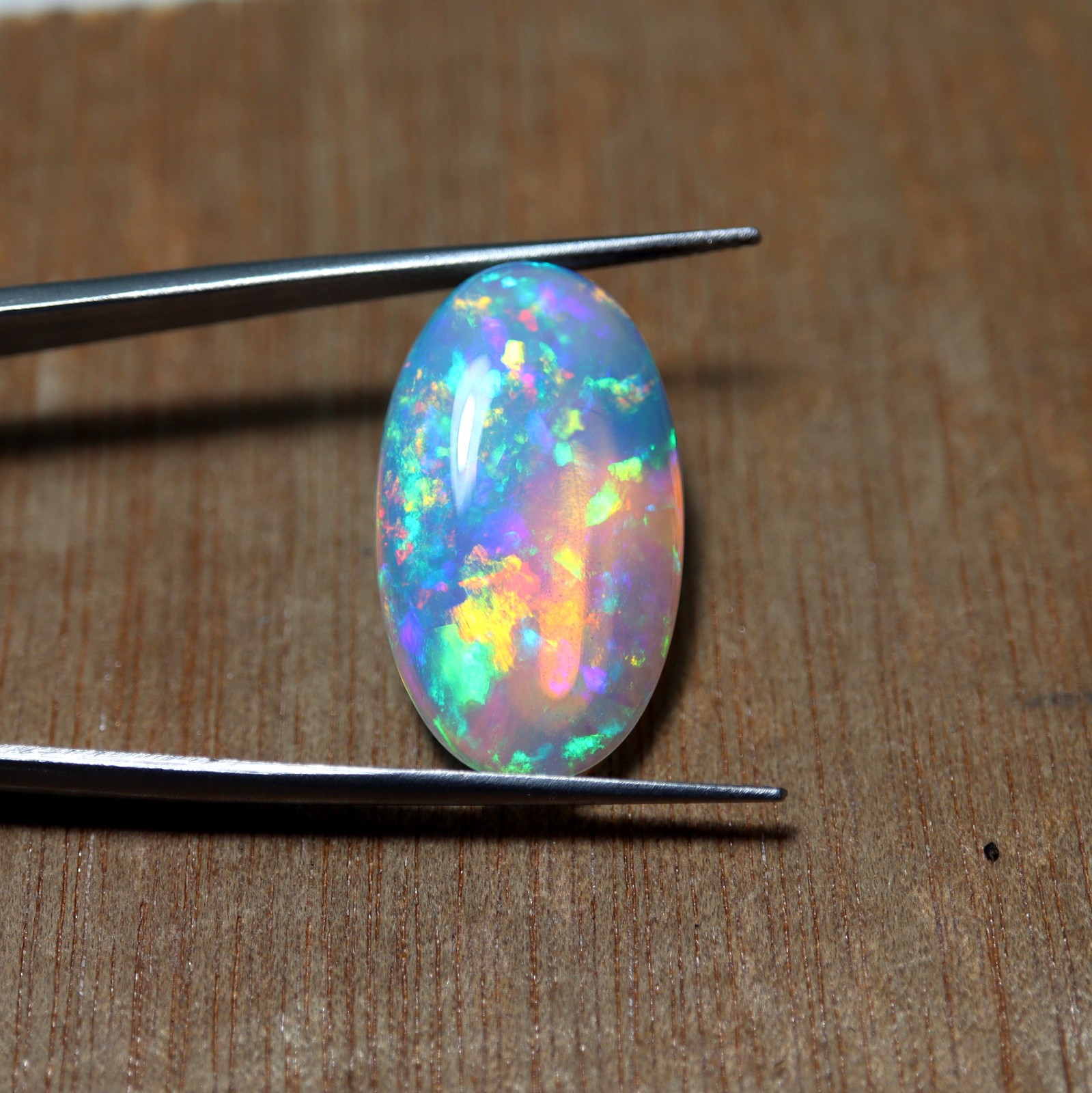 9.2 Ct 24.7×14.5 MM Natural Top Grade Rainbow Fire Ethiopian Opal Oval Cabochon