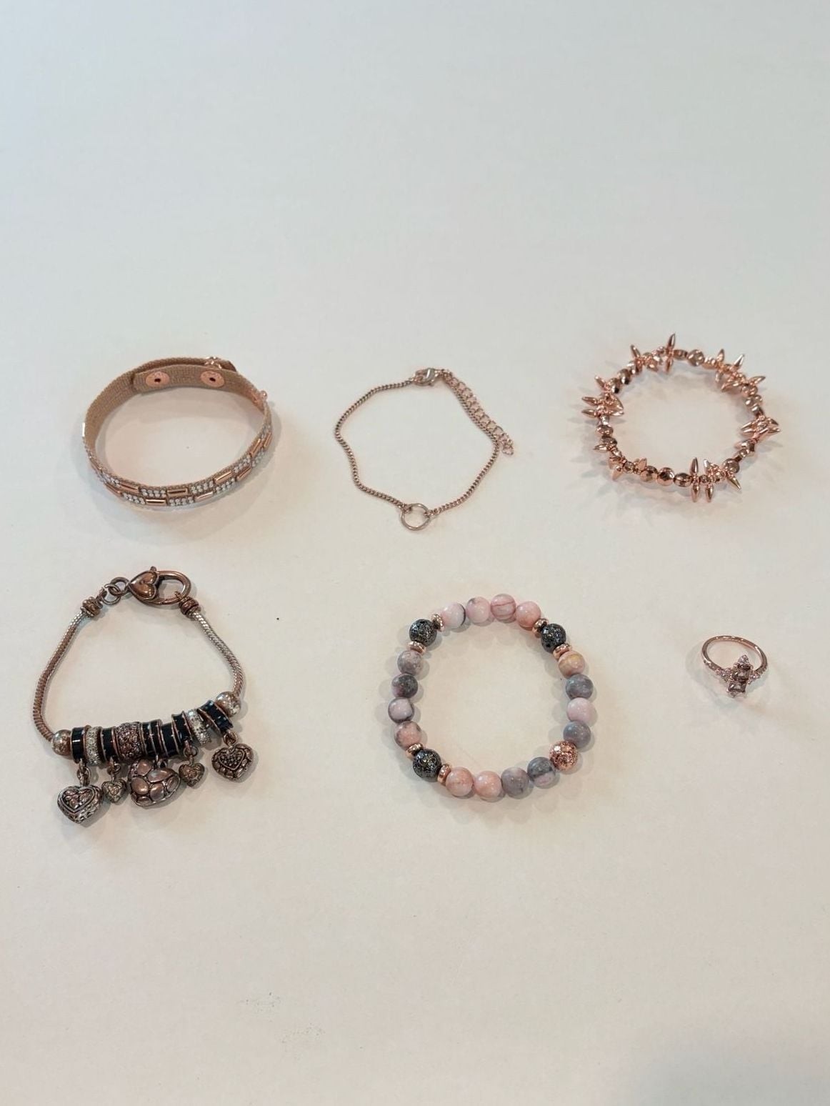 Set of 5 Rose Gold Tone Fashion Bracelets, a Ring and a Charm