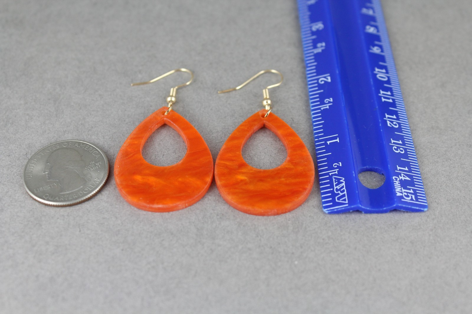 Orange teardrop earrings lightweight dangle cut out oval outline 2.25″ long